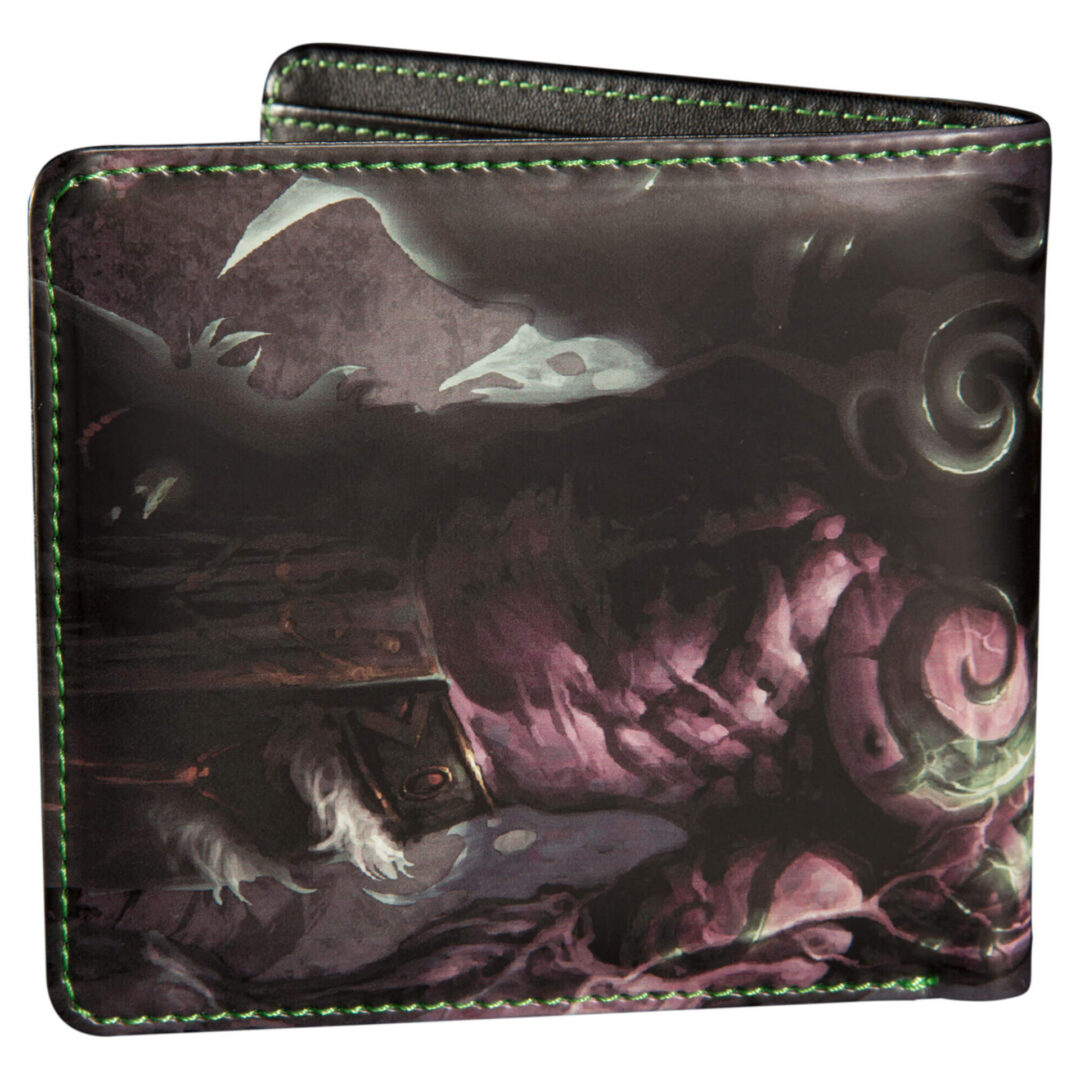 A wallet with an image of a demon on it.