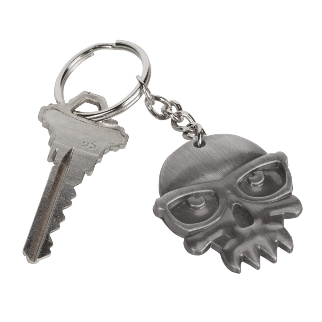 A keychain with a skull and sunglasses on it.