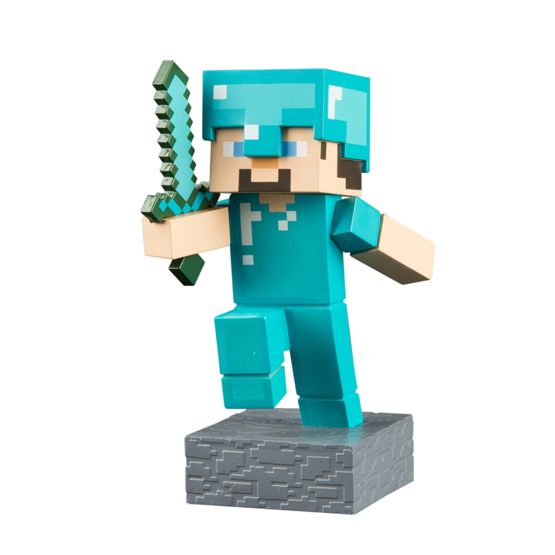 A minecraft figurine with a sword on top of it.